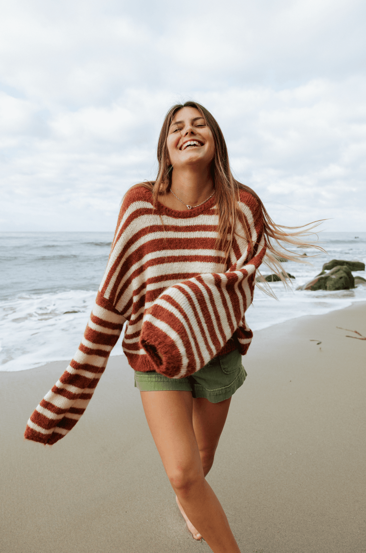 Sisstr Ocean Shores Sweater in rust with white stripes, perfect for beach outings.