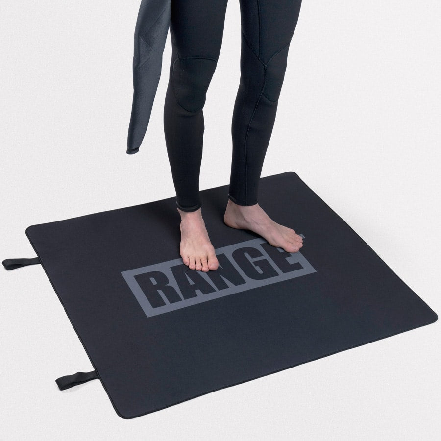 Black Range Neoprene Mat with person standing barefoot on it.