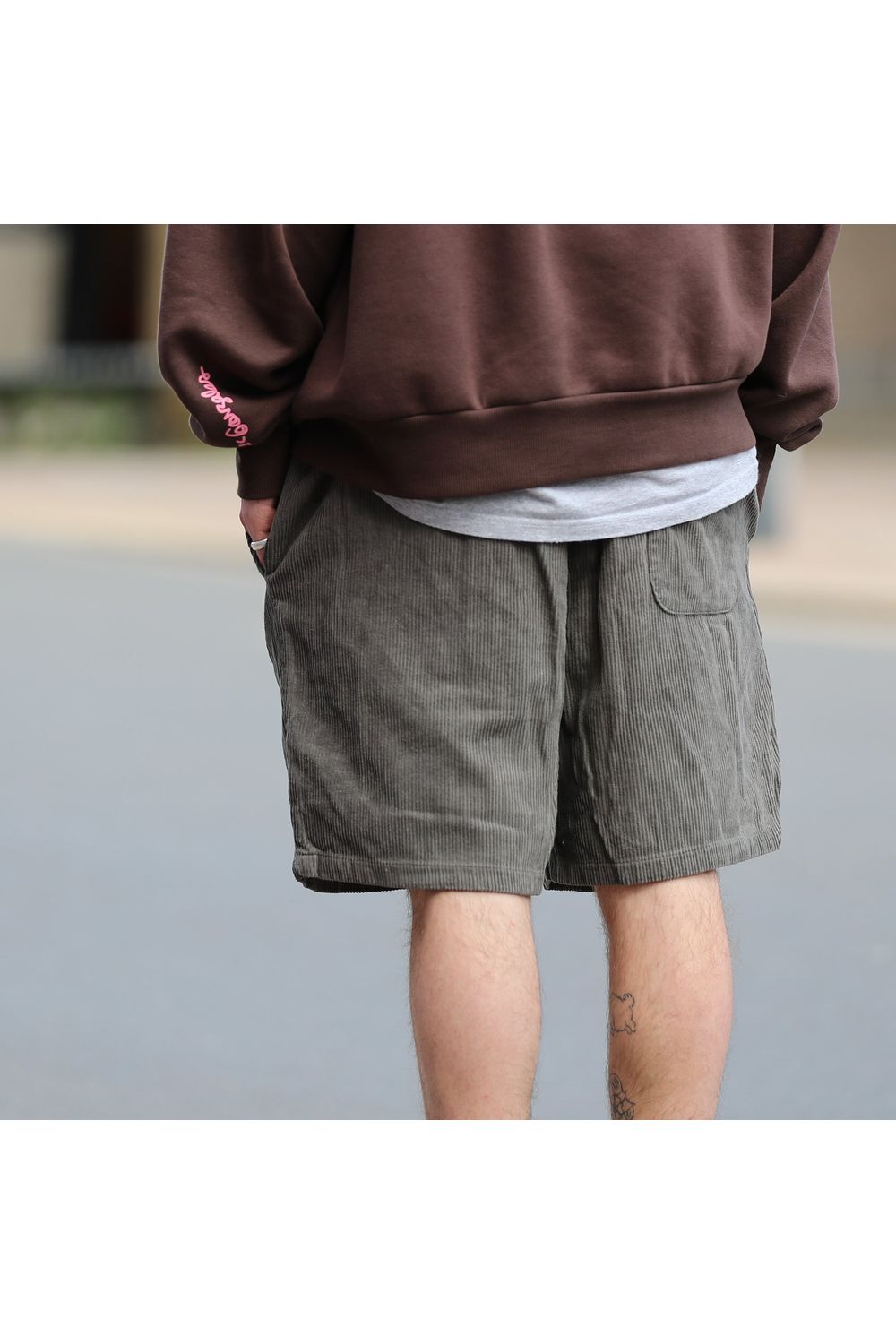 Bamboobay Olive green cord shorts hands in pockets back view